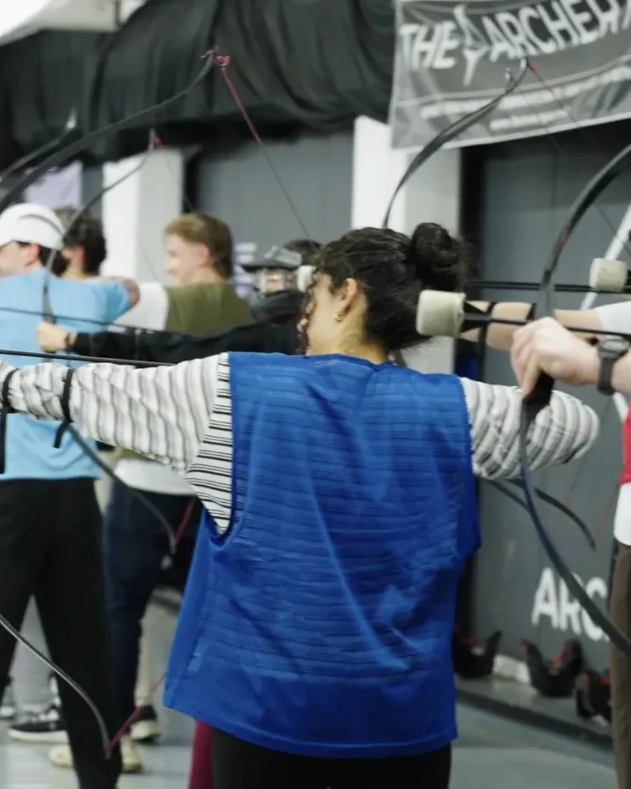 Colleagues lining up their shots at the Leadly archery day