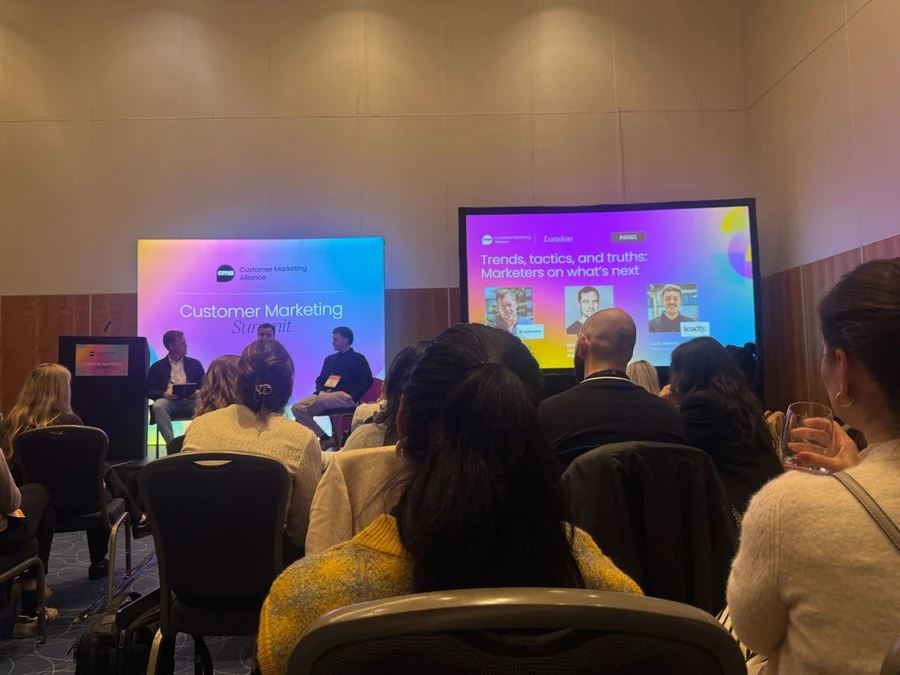 The panel on stage at the Customer Marketing Alliance Summit