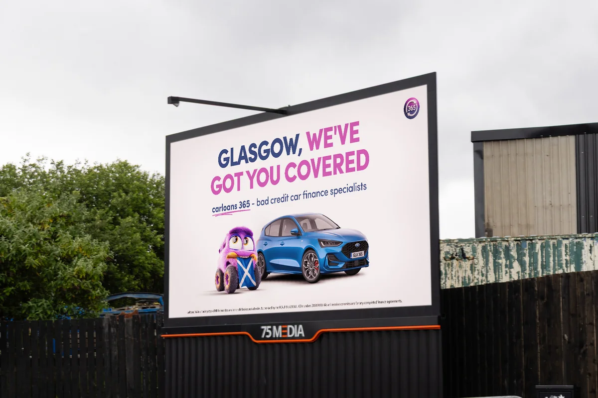 A carloans365 digital billboard in Glasgow reading “Glasgow, we’ve got you covered”