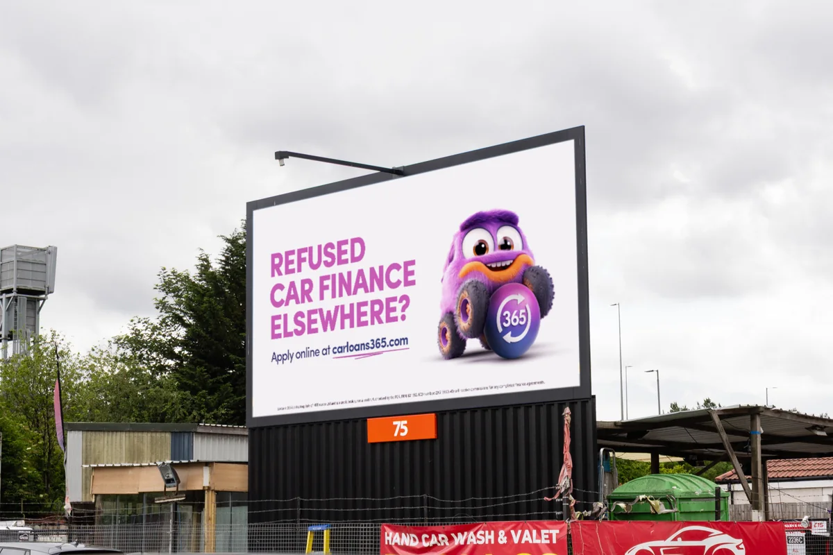 A carloans365 digital billboard in Glasgow reading “Refused car finance elsewhere?”